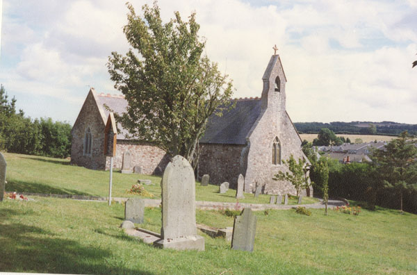 Photograph of St Jeromes Church Llangwm Pembrokeshire showing some of the graveyard